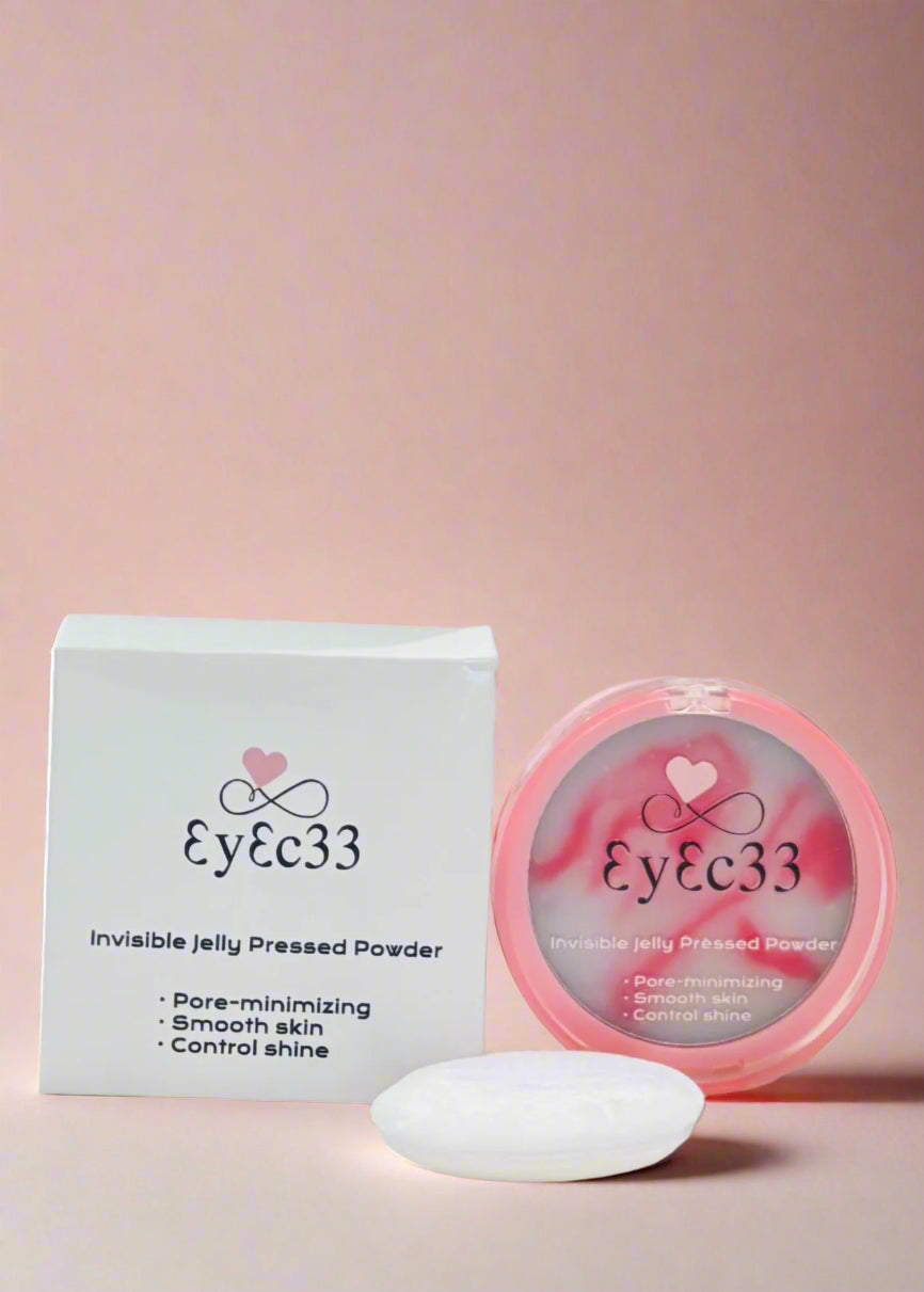 Eyec33 pressed powder with packaging on a pink background