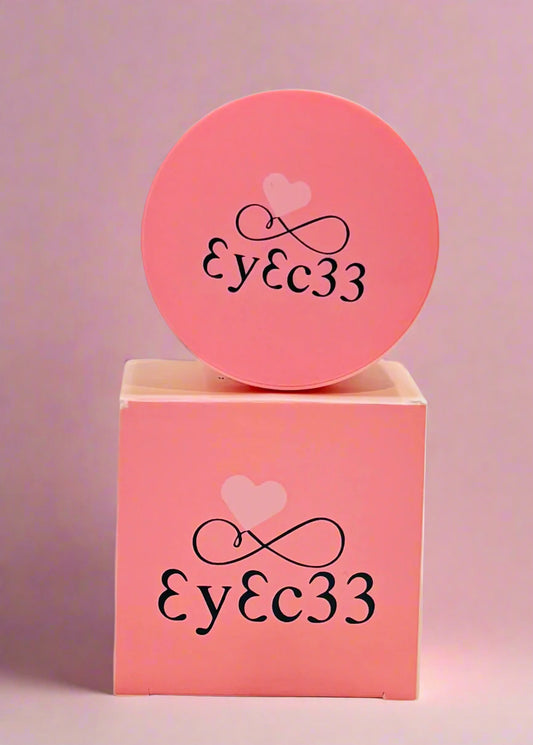 EyEc33 Loose Matte Powder on a pink background